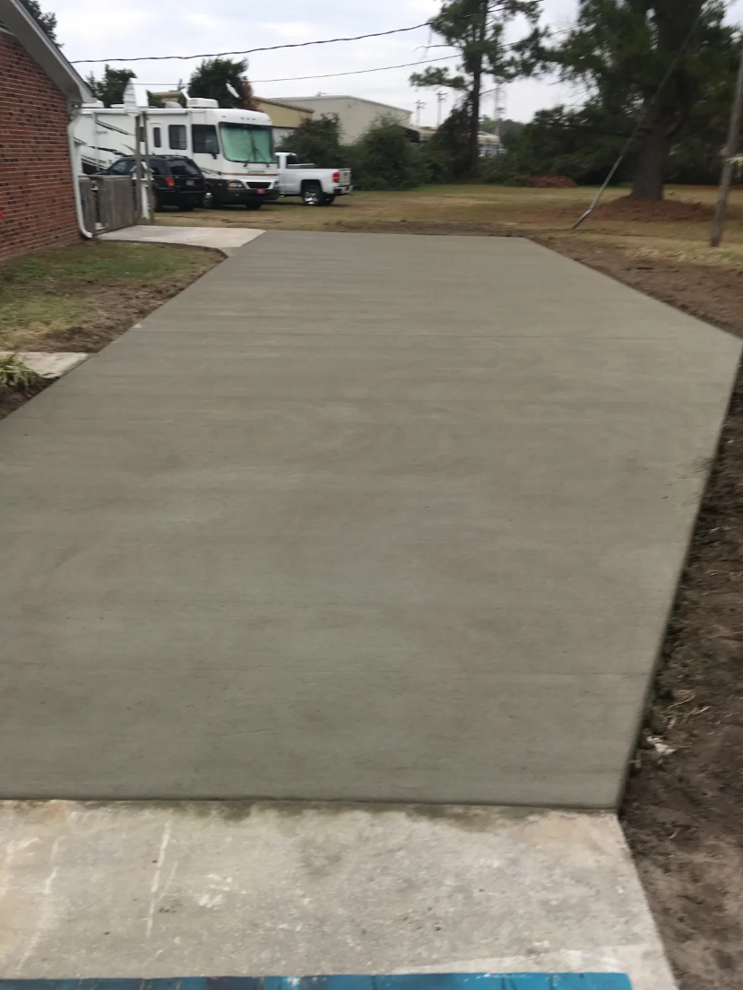 Freshly poured concrete driveway by RBM Builders